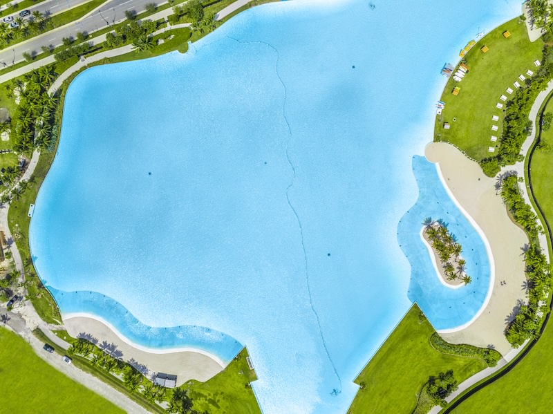 aerial photo of a body of water with a trail around it