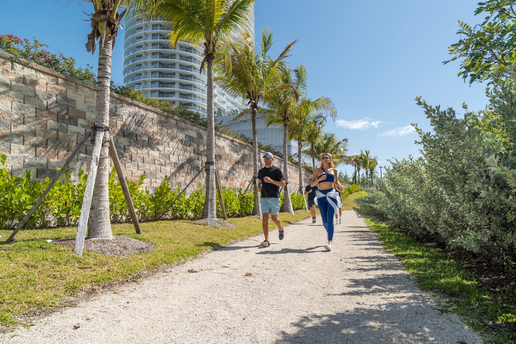 A new standard of living people running on a path outdoors