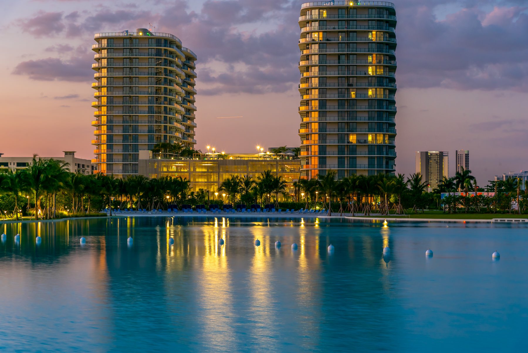 Resort-style swimming pool a large pool with buildings in the background