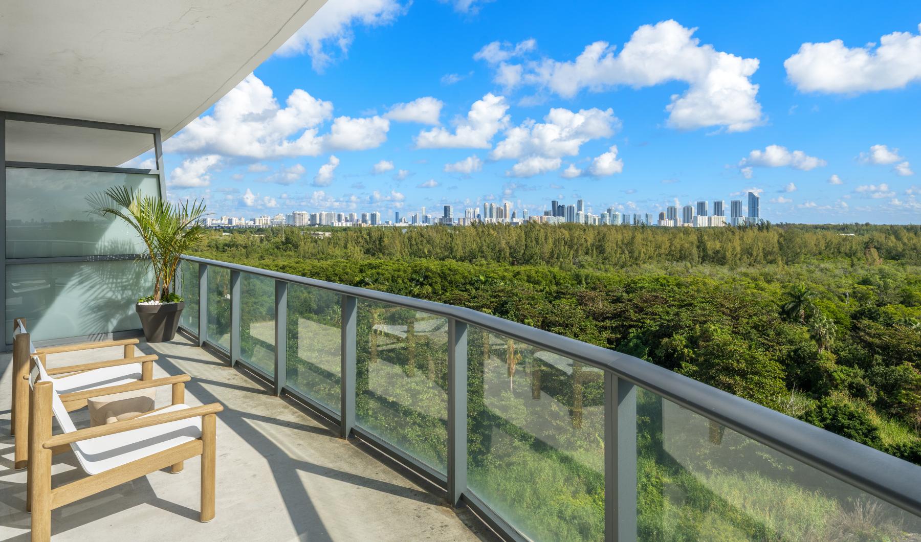 Spacious balconies a deck overlooking a city