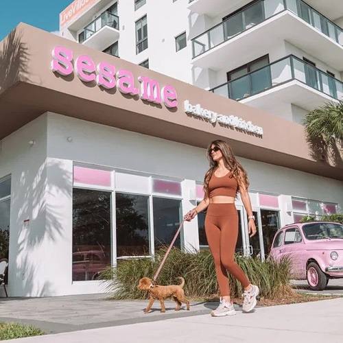 SESAME BAKERY a woman walking her dog