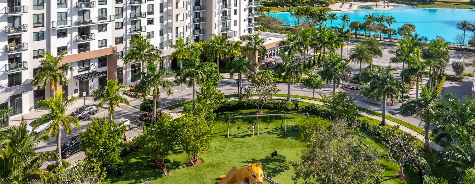 a building with a landscaped park and lagoon