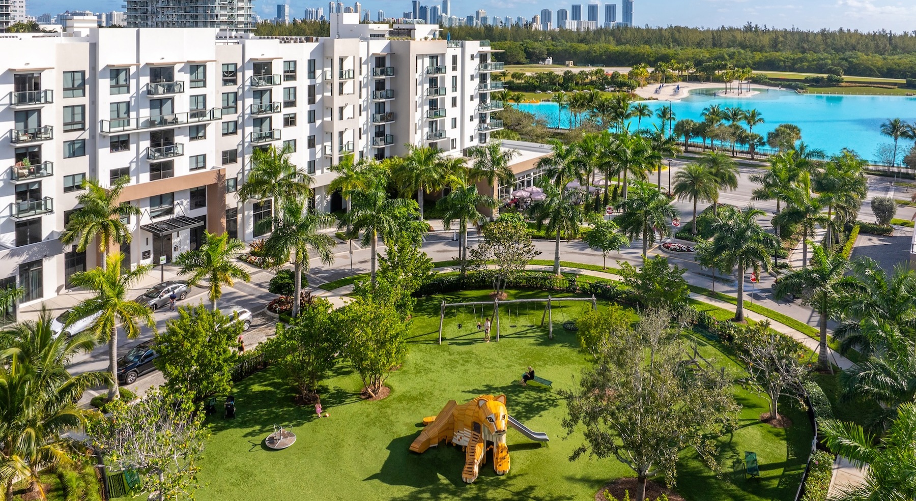 a building with a landscaped park and lagoon