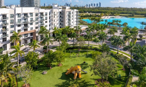 a building with a landscaped park and lagoon