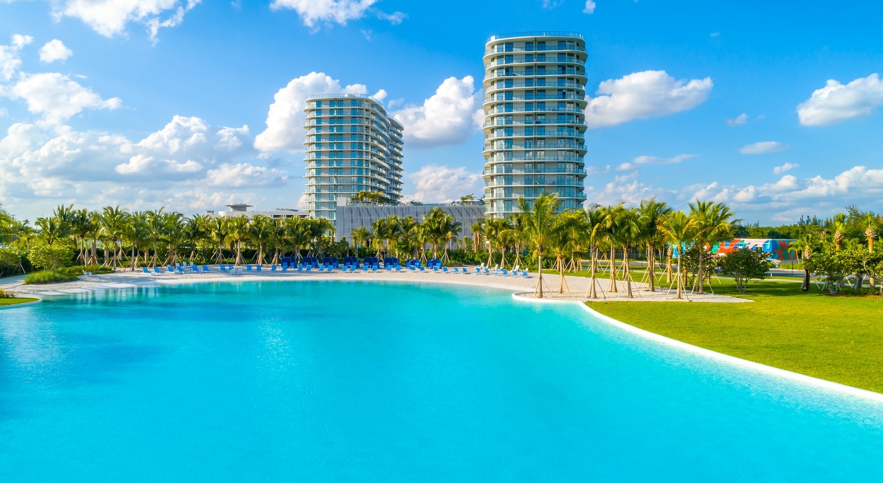 a large resort-style pool with buildings