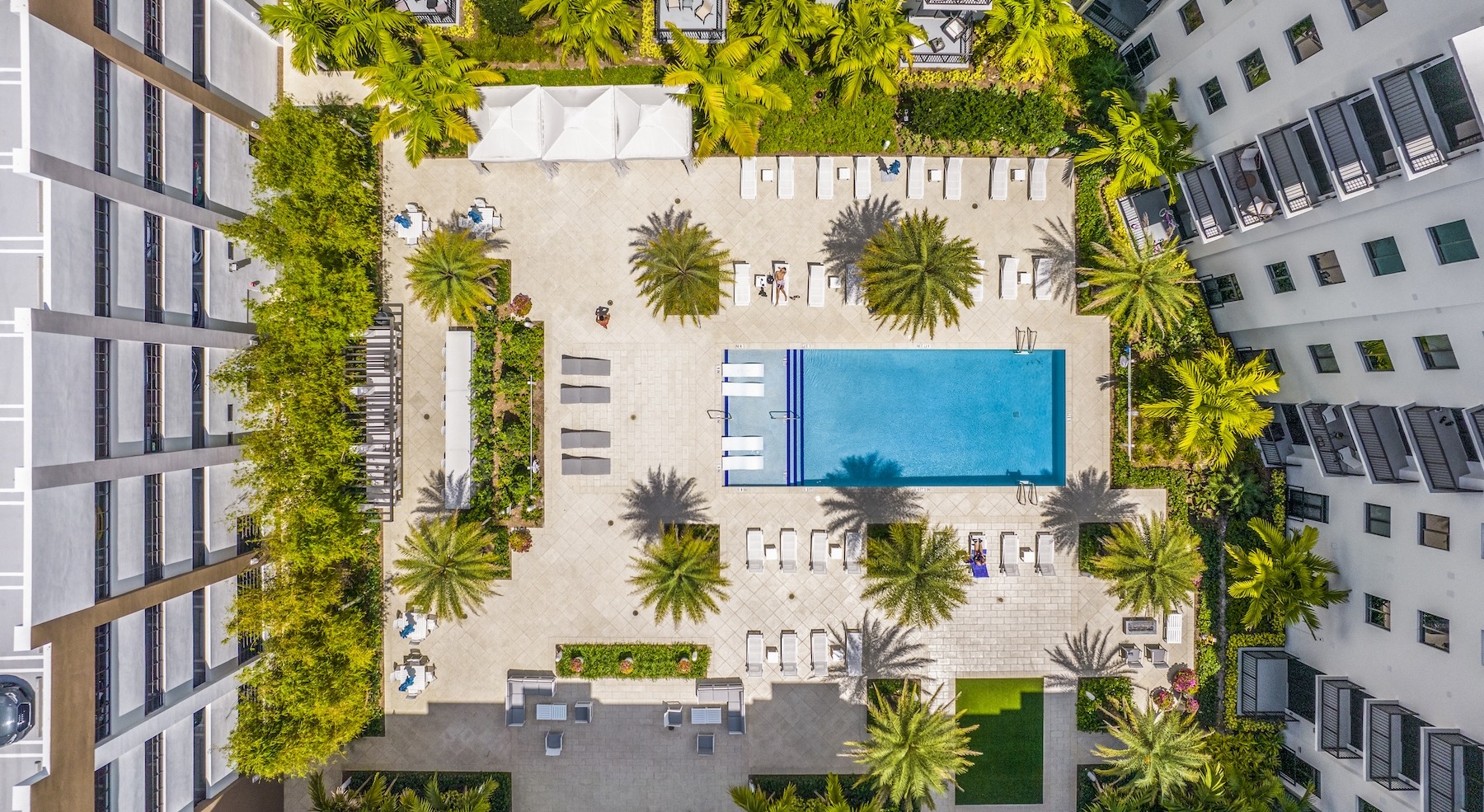 an aerial of a pool in a courtyard