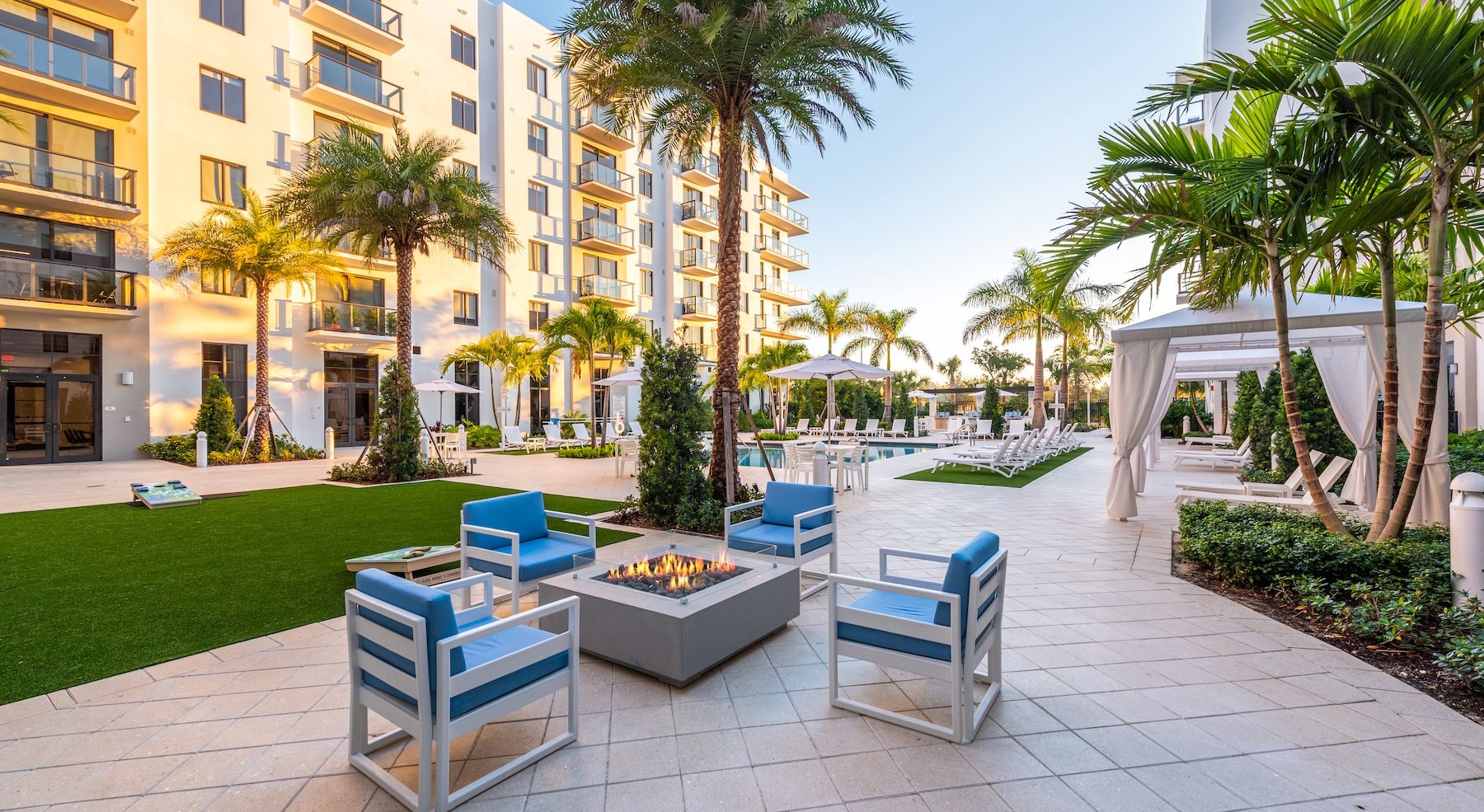 outdoor lounge area next to pool