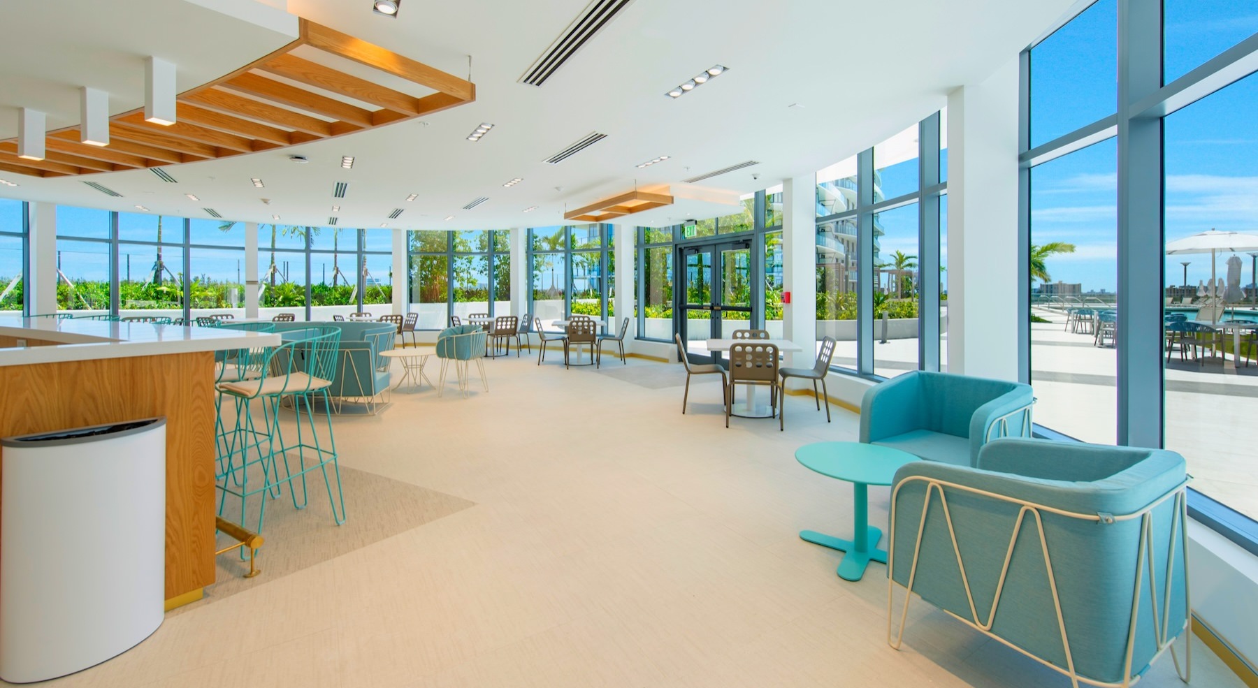 a clubroom with tables and chairs