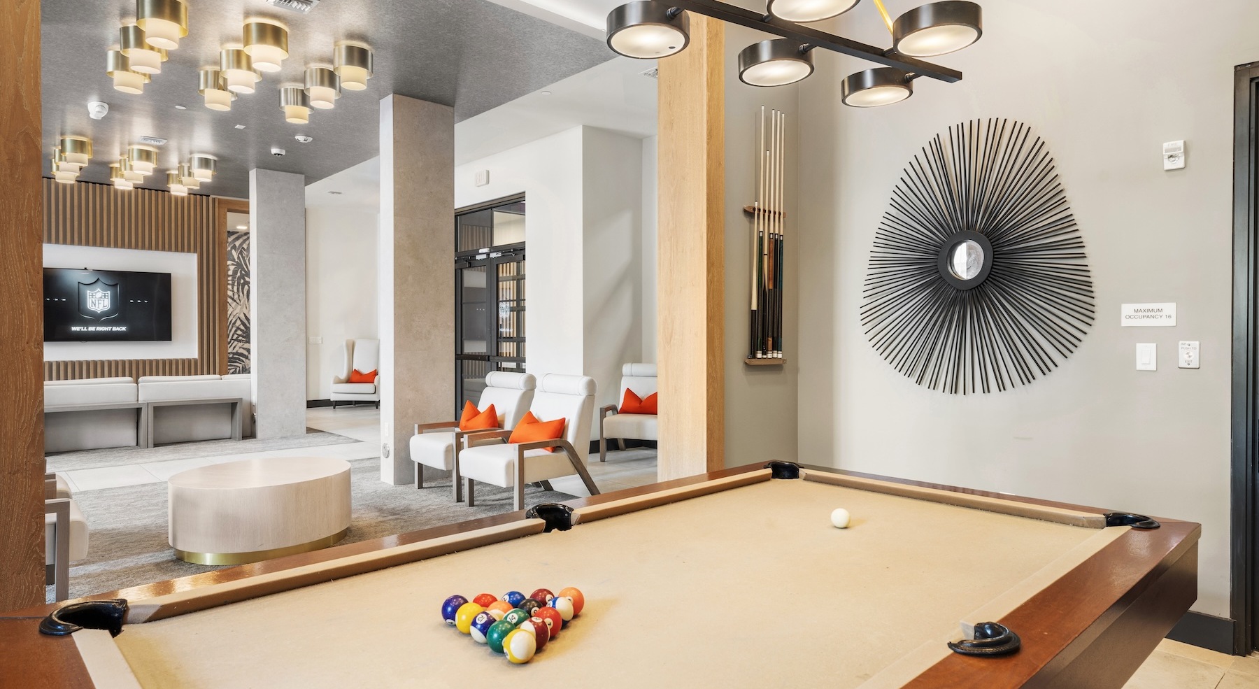 a clubroom with a billiards table