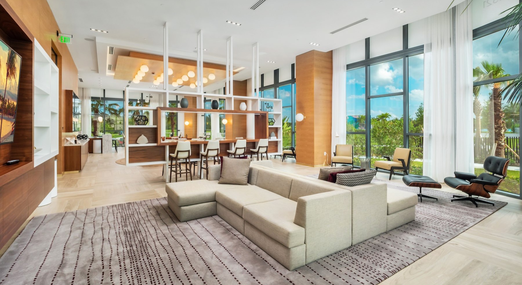 a clubroom with couches, tables and chairs