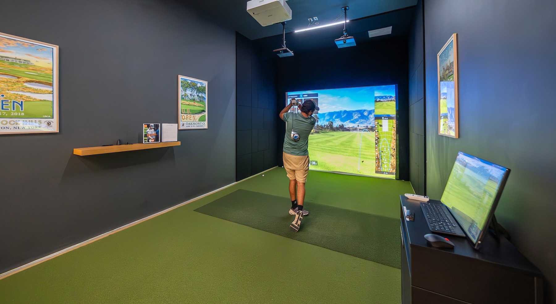 a man using a golf simulator