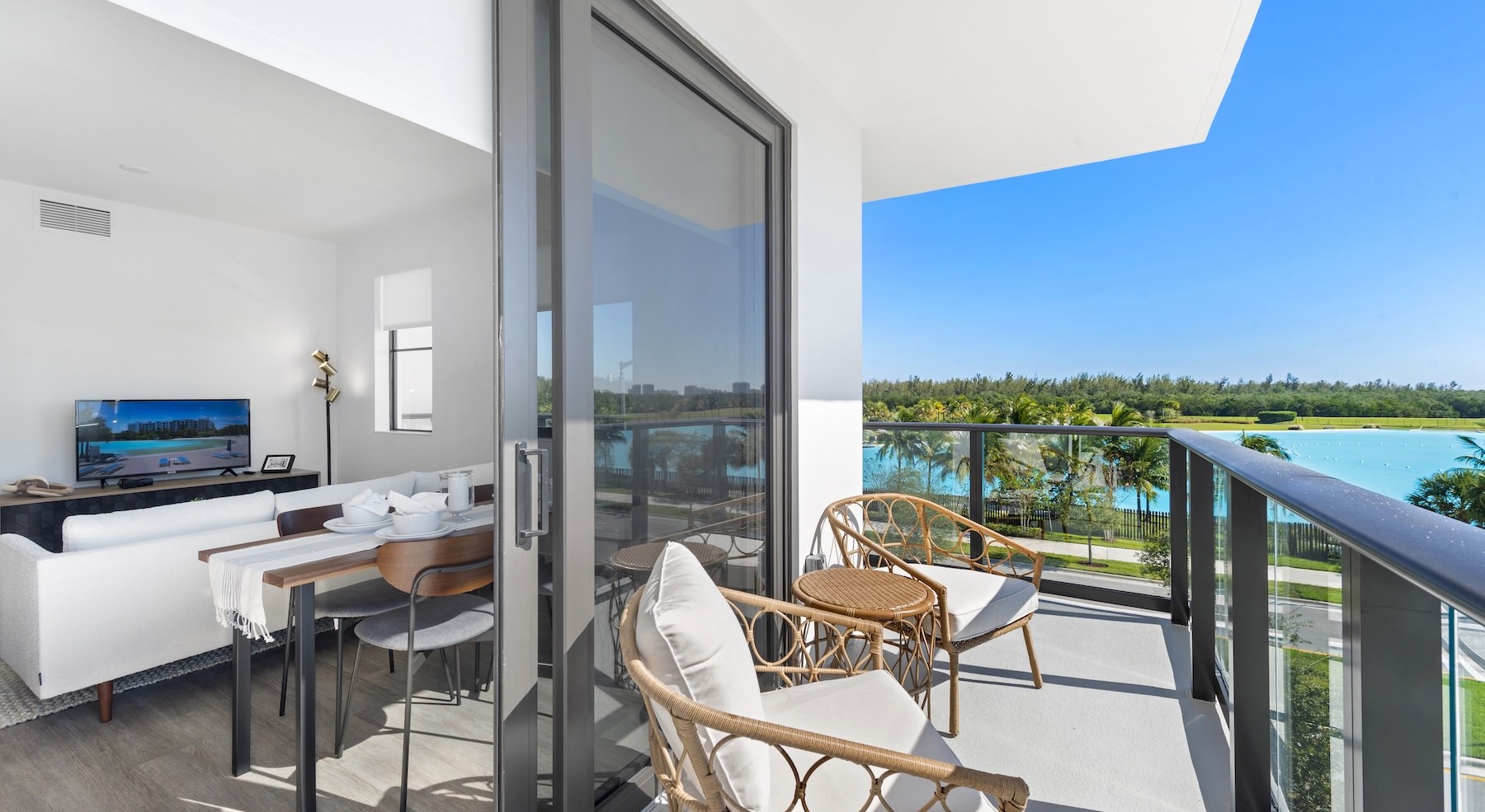 balcony with sliding glass door and view of the water
