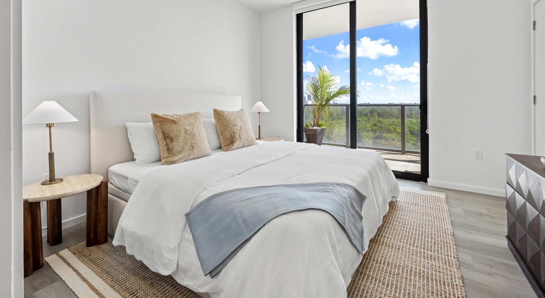 a bedroom with a bed and two nightstands