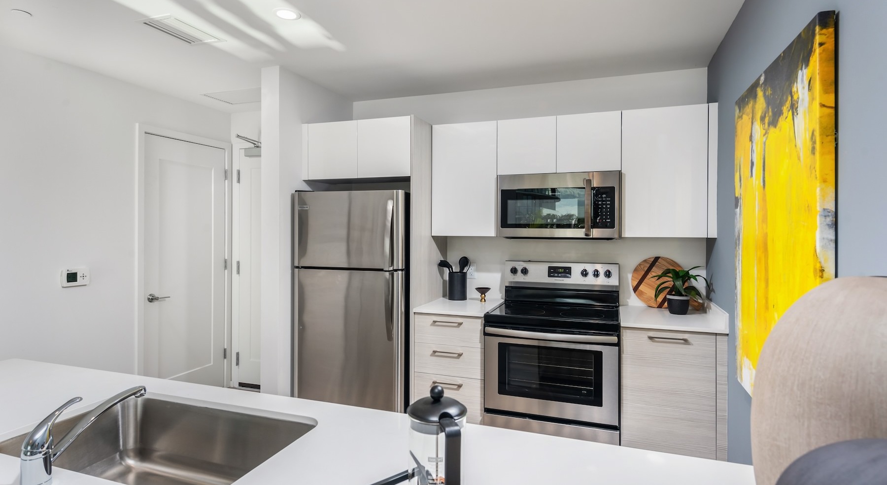 a kitchen with white cabinets