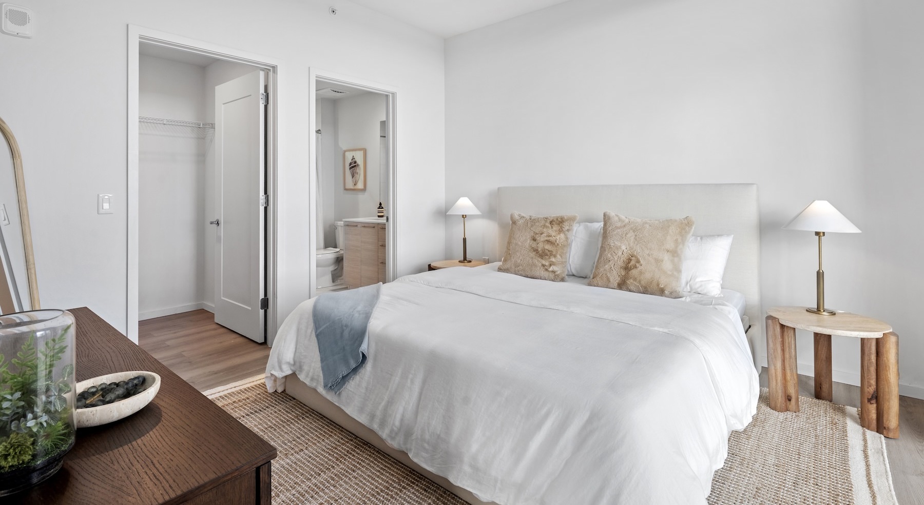 a bedroom with a bed and two nightstands