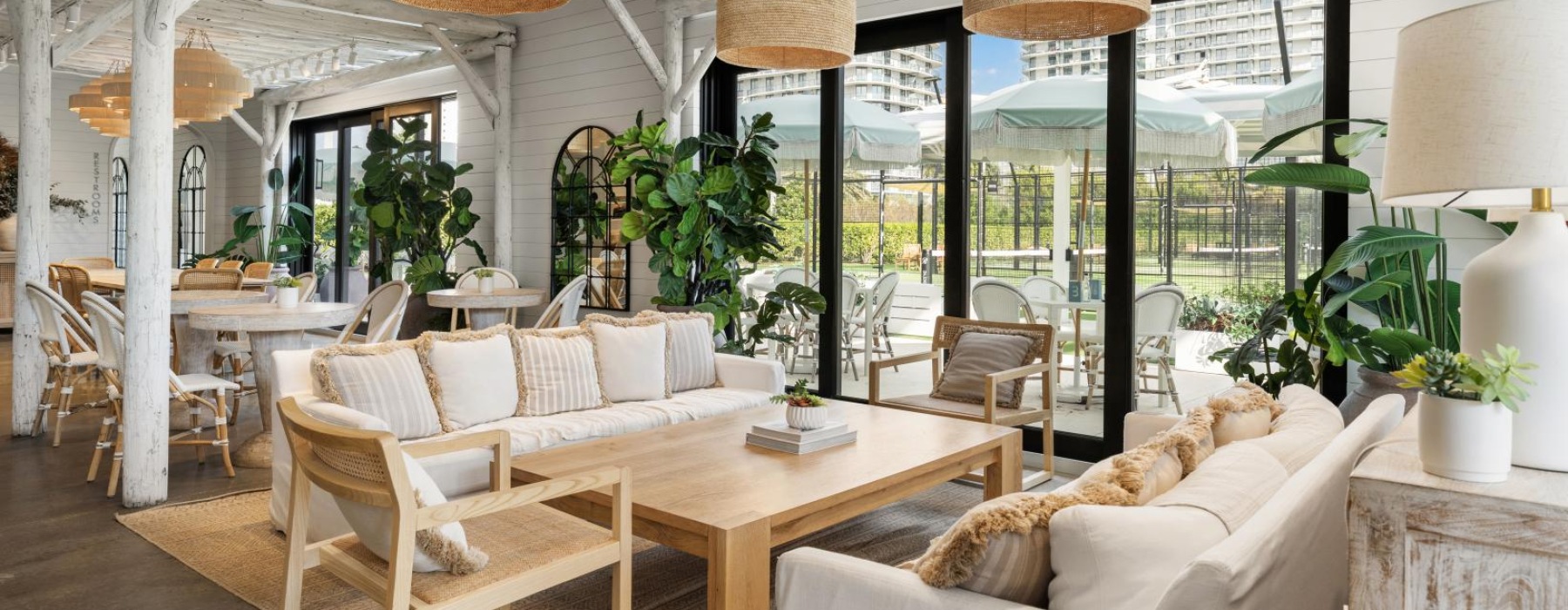 a clubroom with couches, tables and chairs