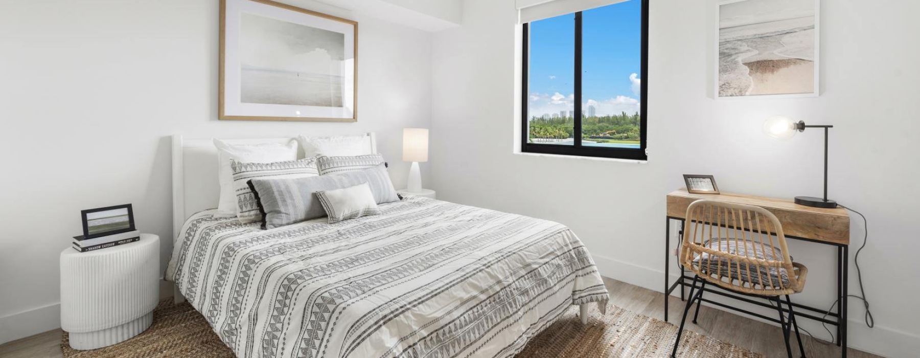 a bedroom with a bed, desk and a chair