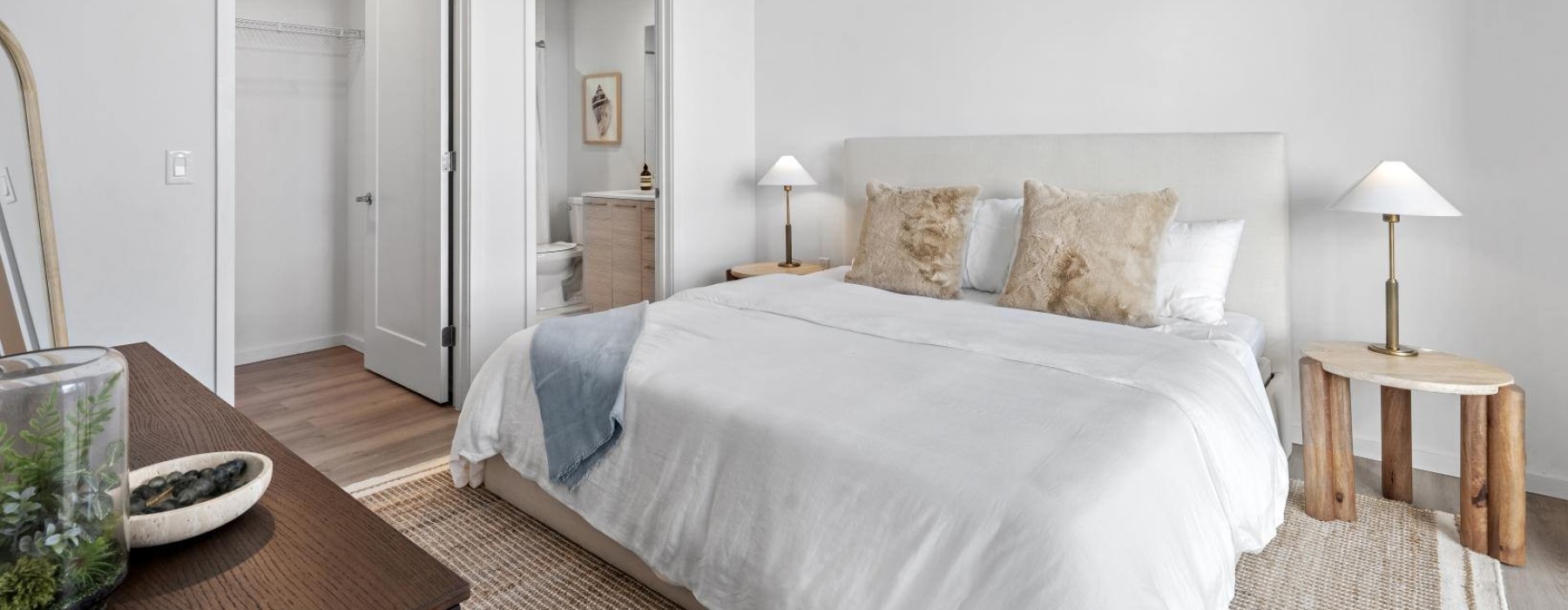 a bedroom with a bed and a dresser