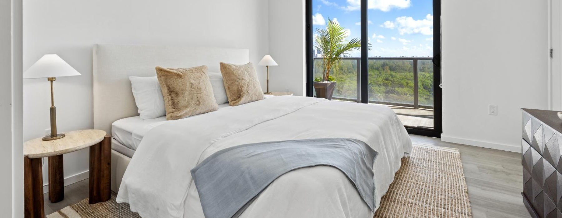 a bedroom with a bed and two nightstands