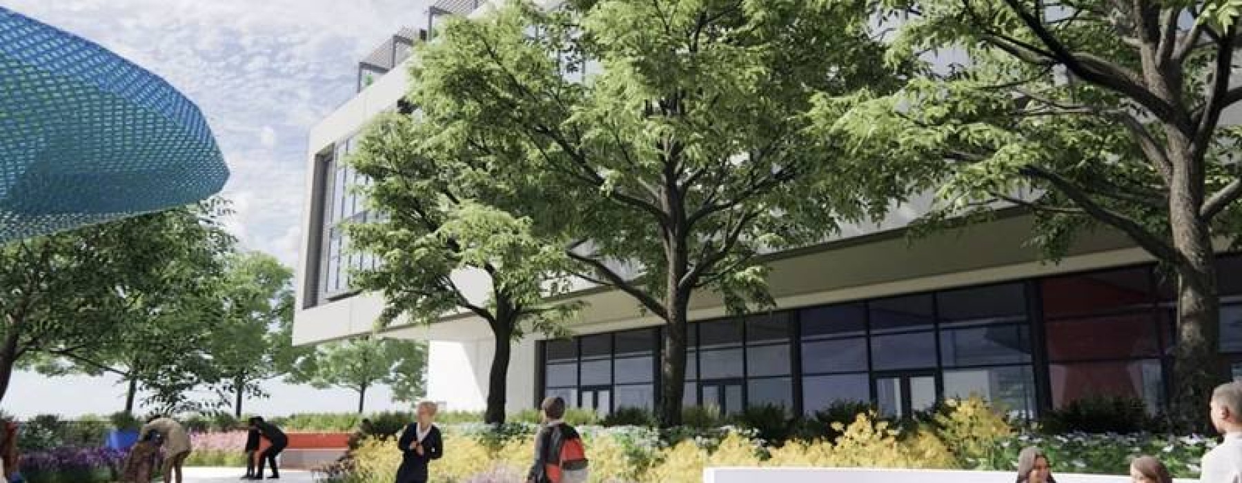 A modern building of an educational institute with large glass windows surrounded by mature trees and people walking along the pathway near SoLé Mia