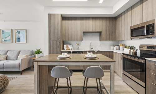 a kitchen with a table and chairs