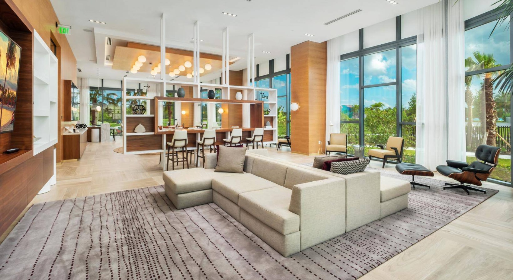 a clubroom with couches, tables and chairs