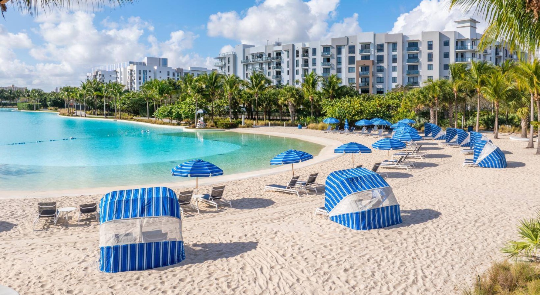 a pool with chairs and umbrellas